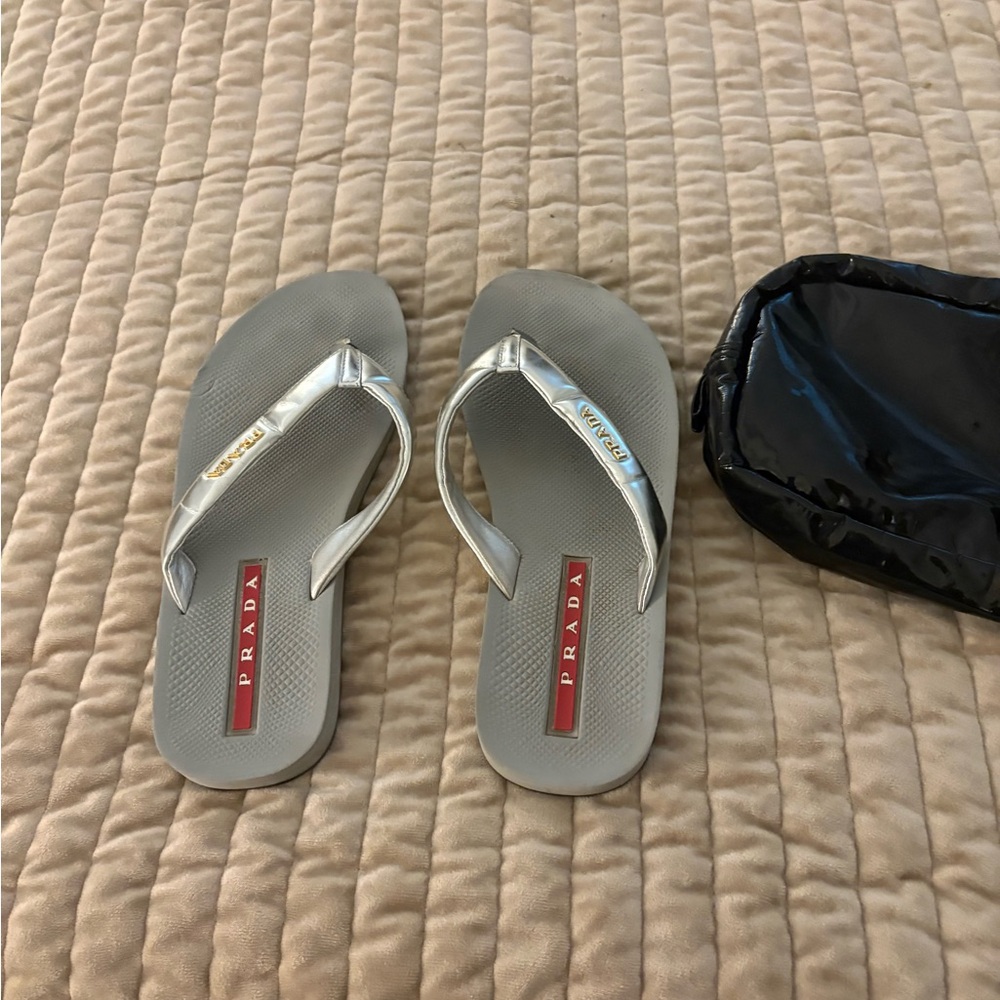 Prada Silver Flip Flops with Red Logo Inset